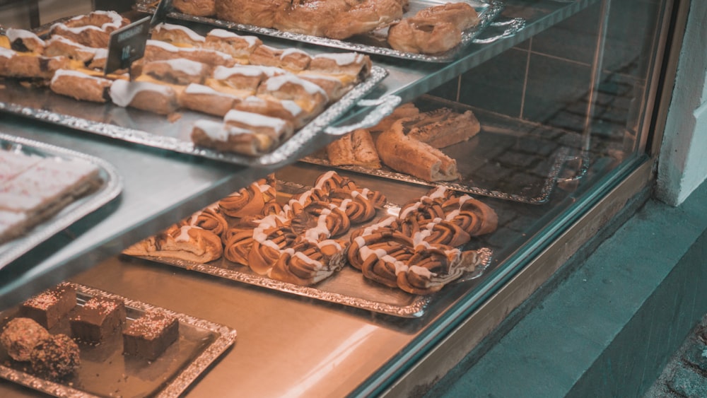 a display case filled with lots of different types of pastries