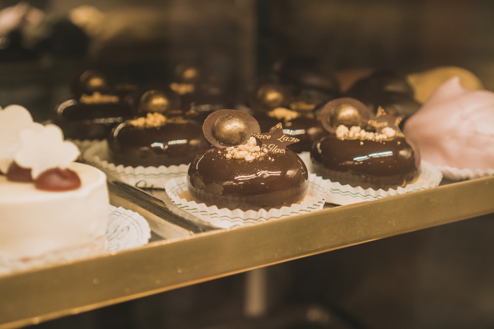 a display case filled with lots of different types of cakes