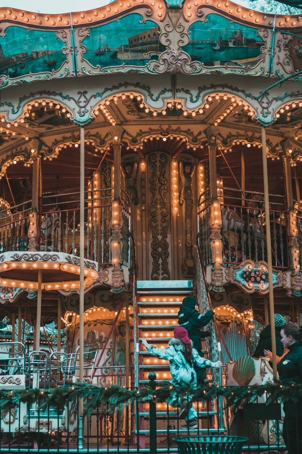 a merry go round with lights and decorations