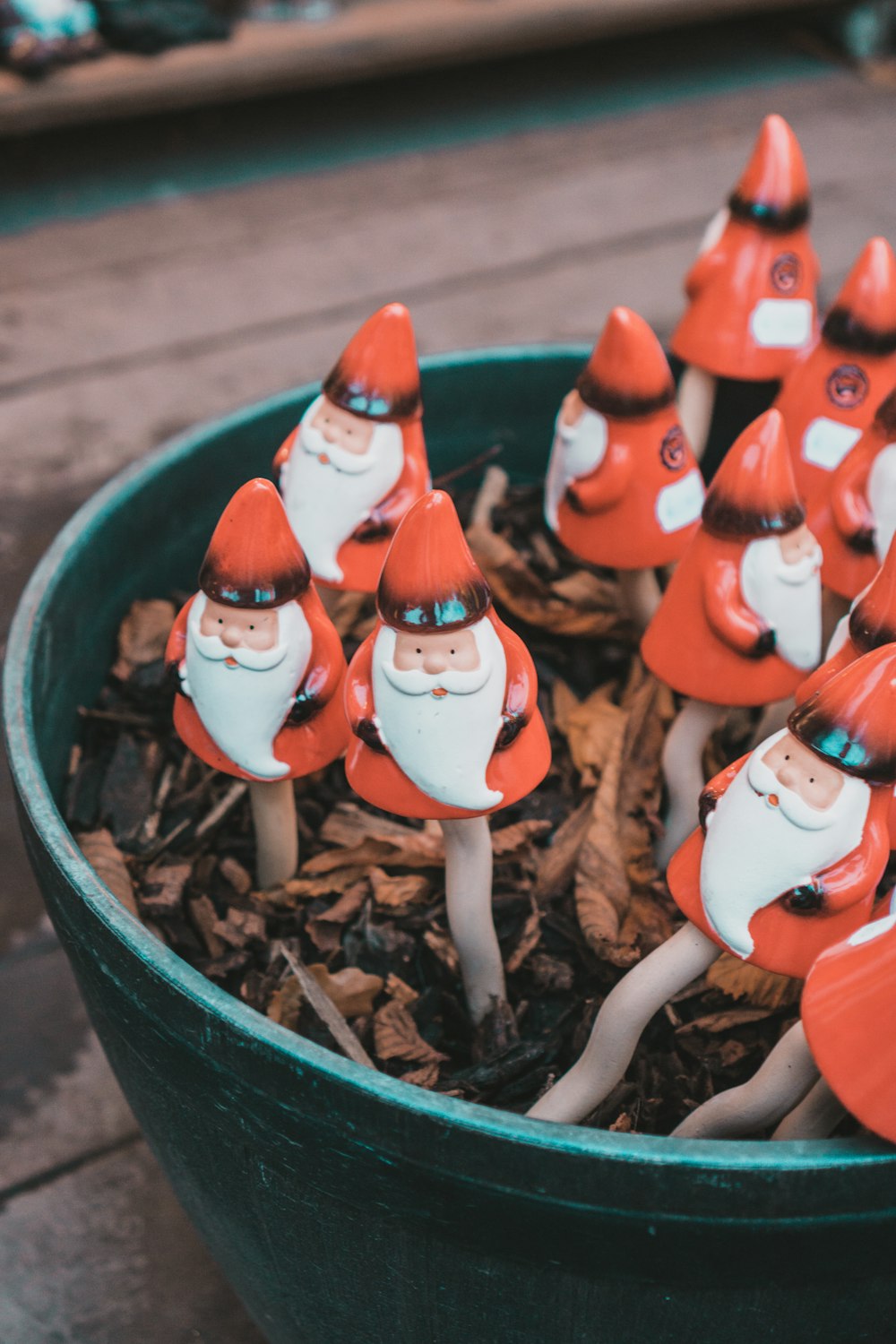 a group of gnome figurines sitting in a pot