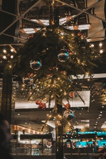 a christmas tree in a store with lights on it
