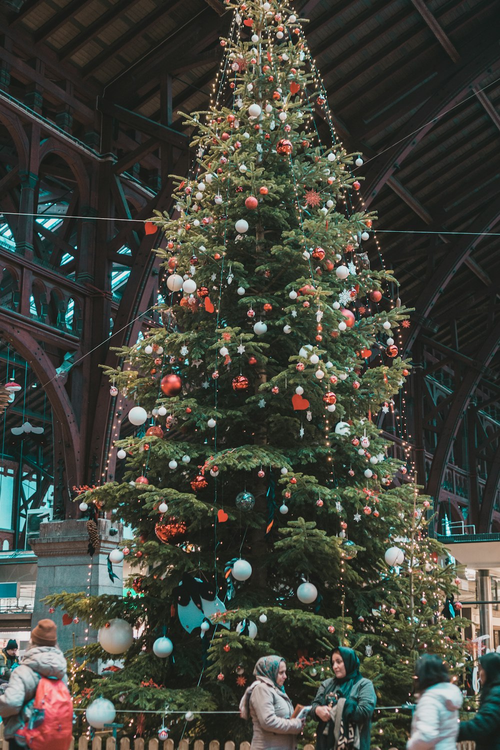 a large christmas tree in a large building