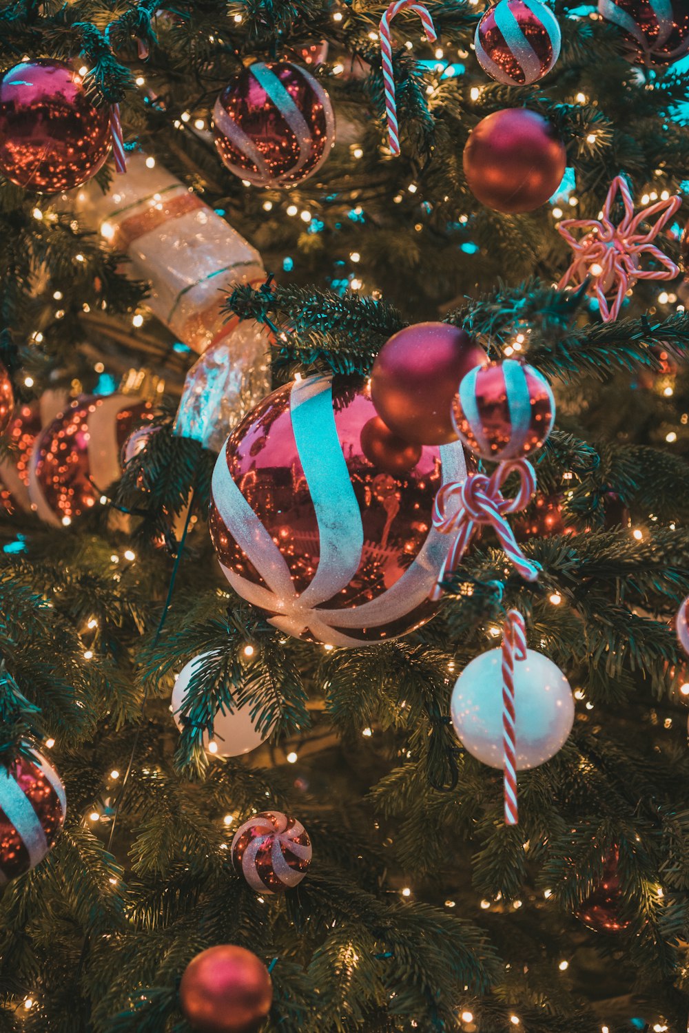 a close up of a christmas tree with ornaments