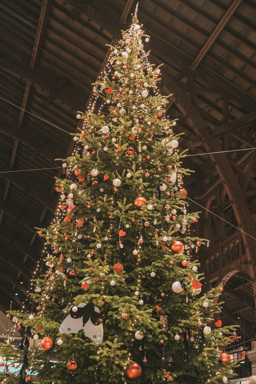 a large christmas tree in a large building