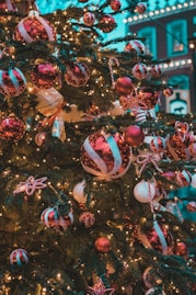 a decorated christmas tree in front of a building