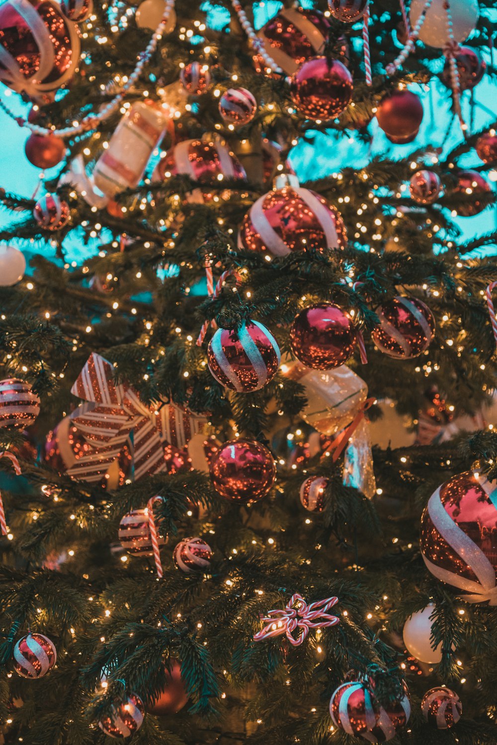 a christmas tree is decorated with ornaments and lights