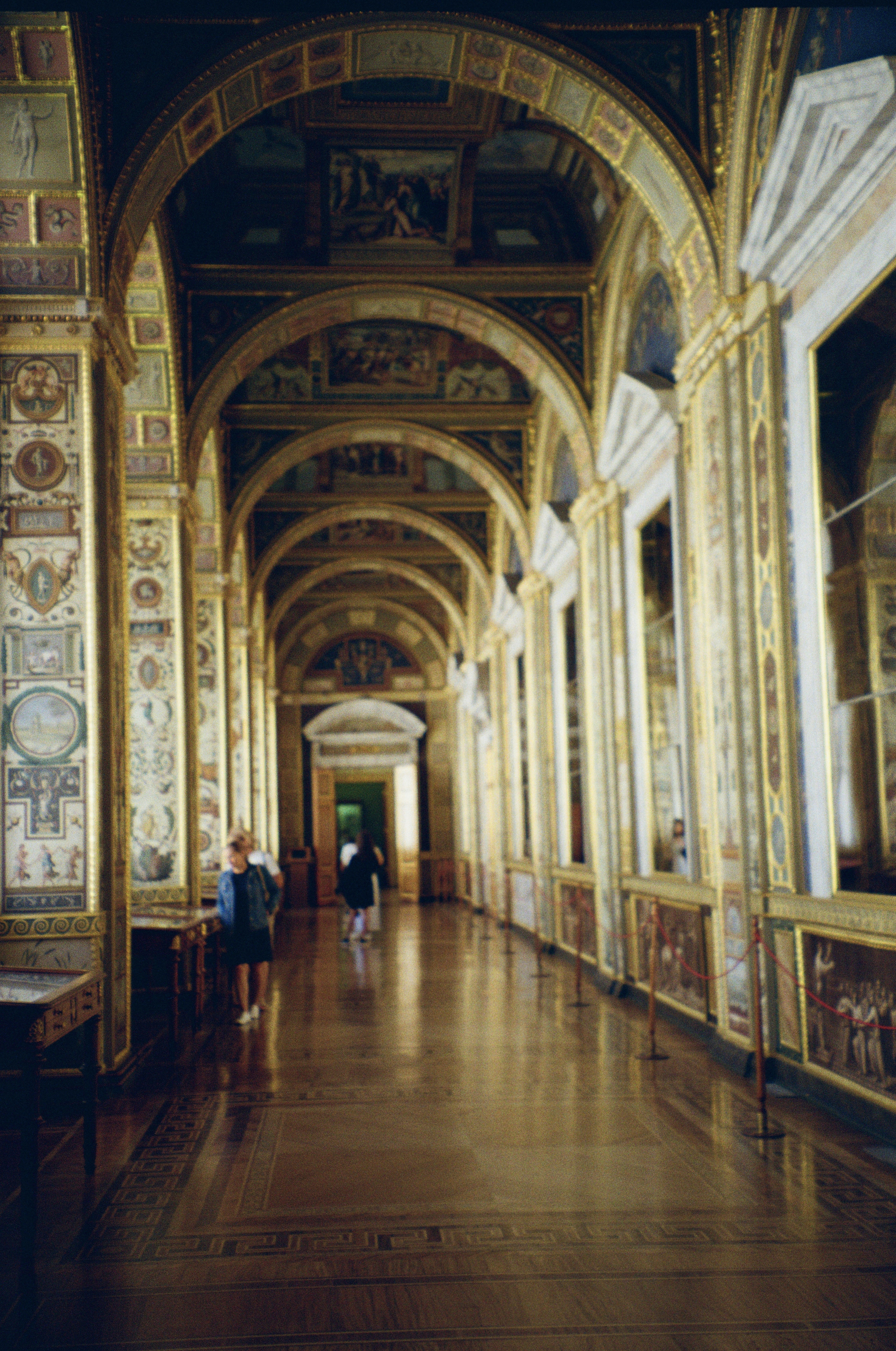 a long hallway with paintings on the walls