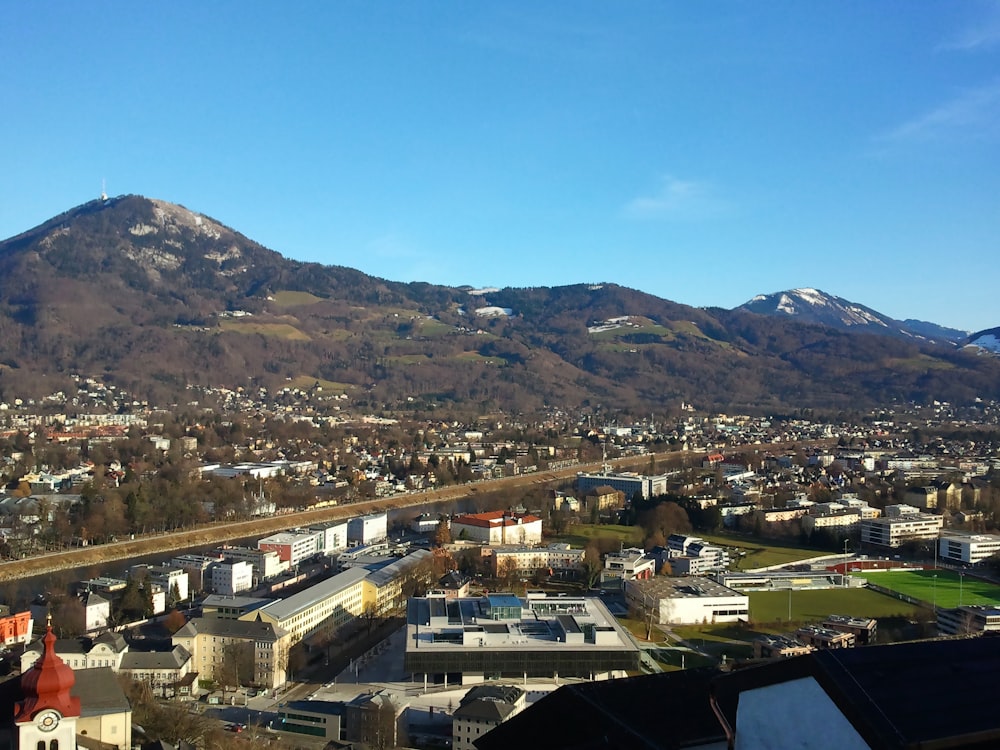 a view of a city with mountains in the background