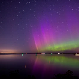A serene night sky with shimmering northern lights reflecting the app’s theme and spirit.