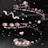Abstract 3D visualization of floating hearts and warm white light particles.
