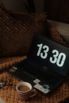 A cozy setup with a laptop displaying an online casino lobby and a cup of coffee nearby.