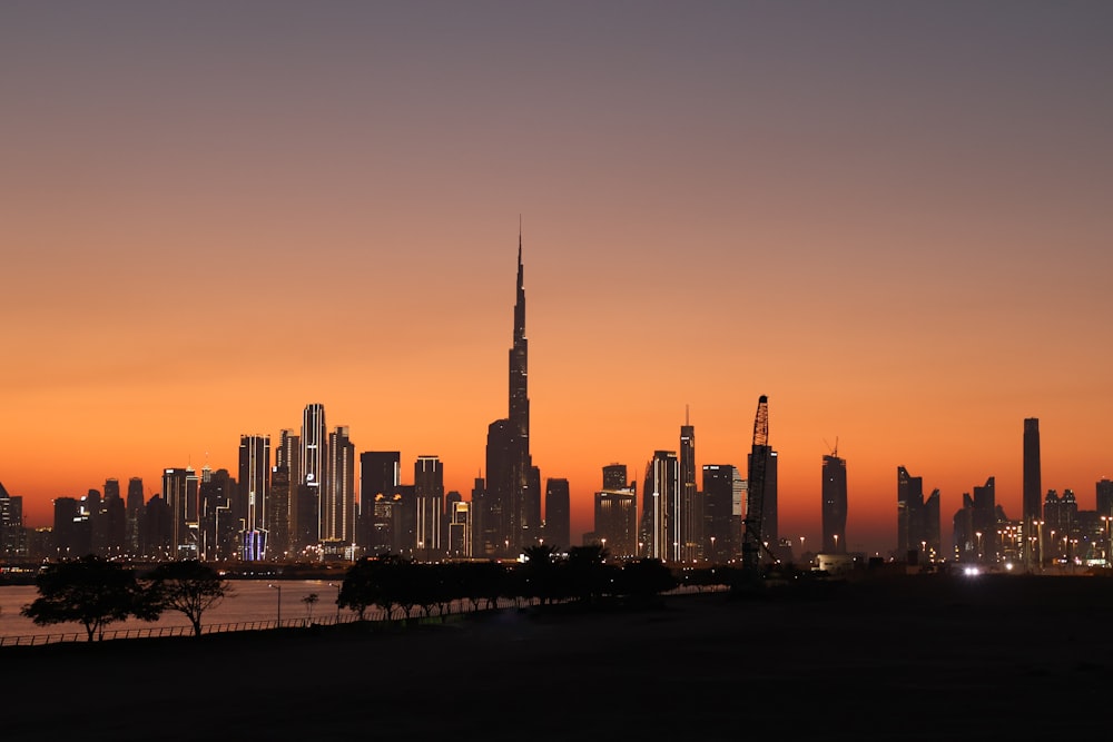 a view of a city skyline at sunset