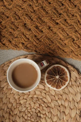 A warm cup of freshly brewed specialty coffee with rustic Chiapas textiles in the background.