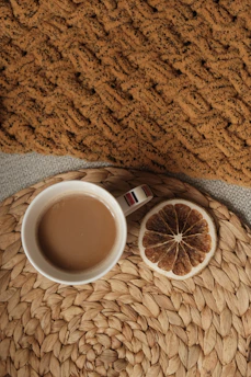 A warm cup of freshly brewed specialty coffee with rustic Chiapas textiles in the background.