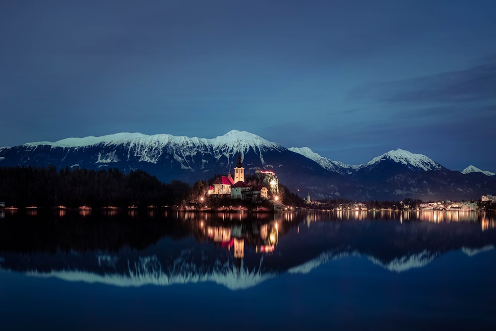 a large body of water with mountains in the background