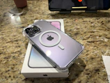 A phone in an OtterBox case dropped from a height onto a wooden floor.