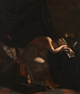 The High Priestess holding a scroll partially hidden beneath her cloak, symbolizing hidden knowledge.
