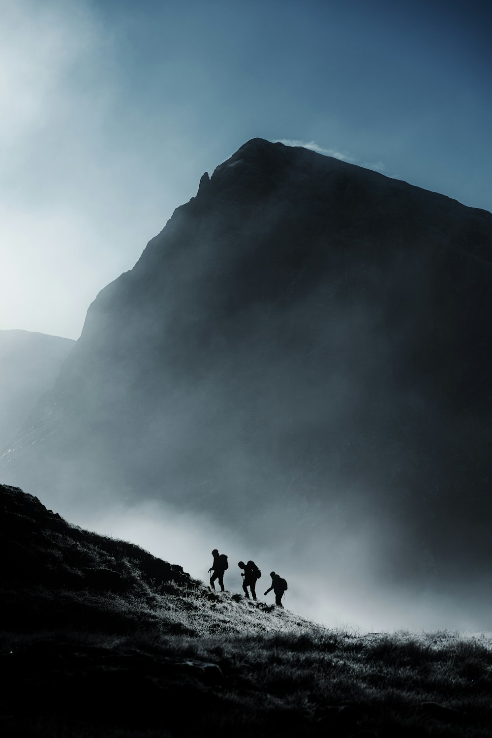 a group of people walking up a hill