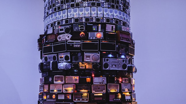 a very tall tower with many electronic devices on it