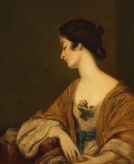 A calm portrait of a woman with a gentle smile, wearing soft colors like old rose and dark blue, evoking warmth and care.