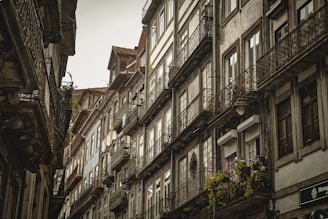 A historic street in the French Quarter lined with charming old buildings and wrought-iron balconies.