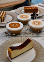A cozy table set with assorted cakes, cookies, and a steaming cup of coffee, ready for a celebration.