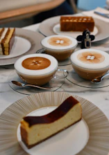 Professional coffee break arrangement with pastries and coffee cups on a corporate event.