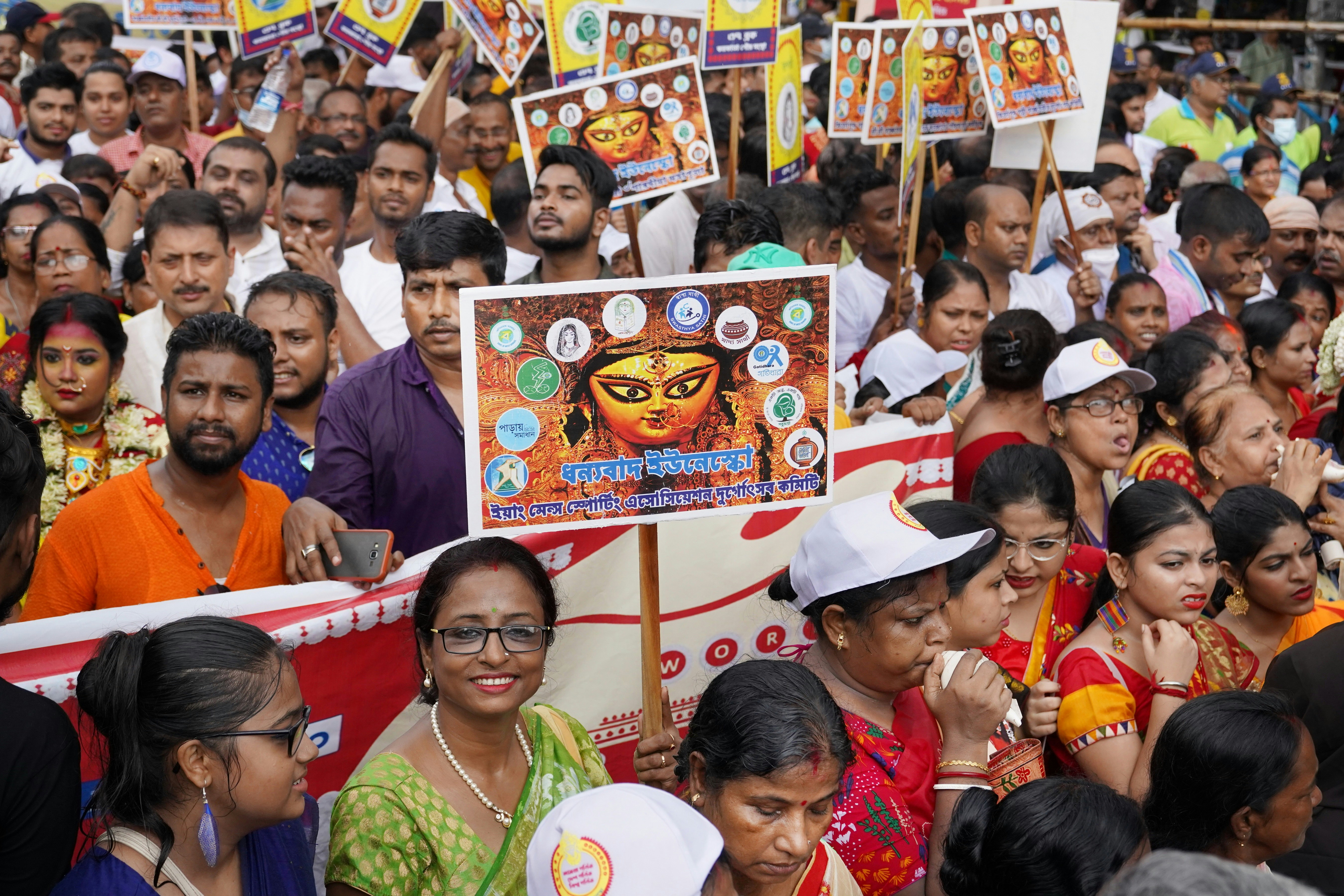 a large group of people holding up signs