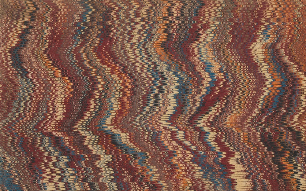 a multicolored rug with a wavy design