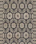 Intricate floral and geometric patterns in symmetrical arrangements dominate the textile design. Cream-colored motifs stand out against a dark background, forming a network of stylized flowers and ornate shapes. The design is bordered by a repetitive pattern of similar motifs.