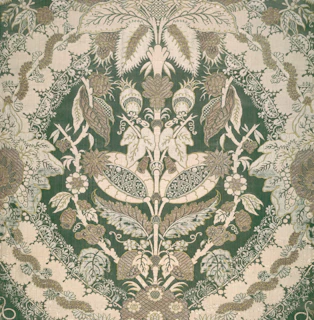 a close up of a green and white rug