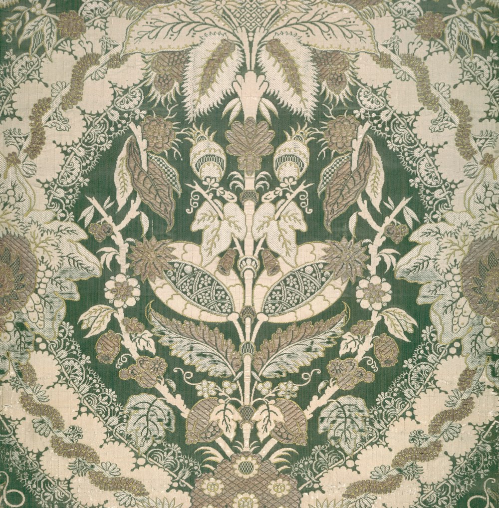 a close up of a green and white rug