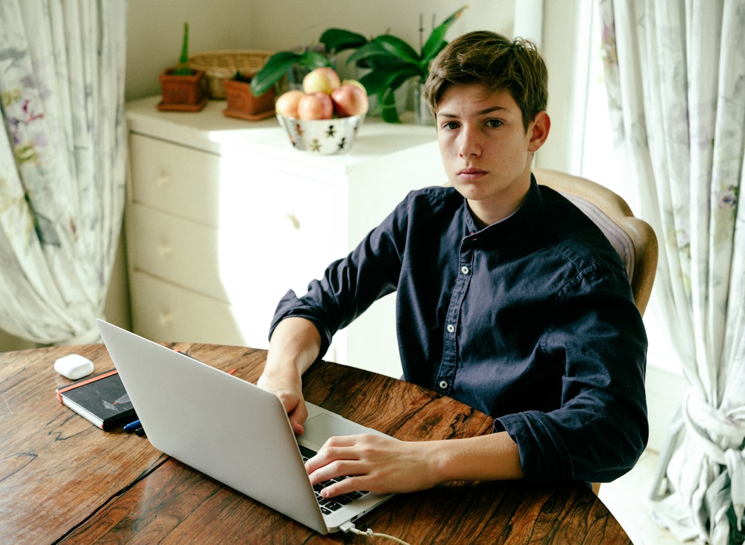 young professional opening investment account on laptop