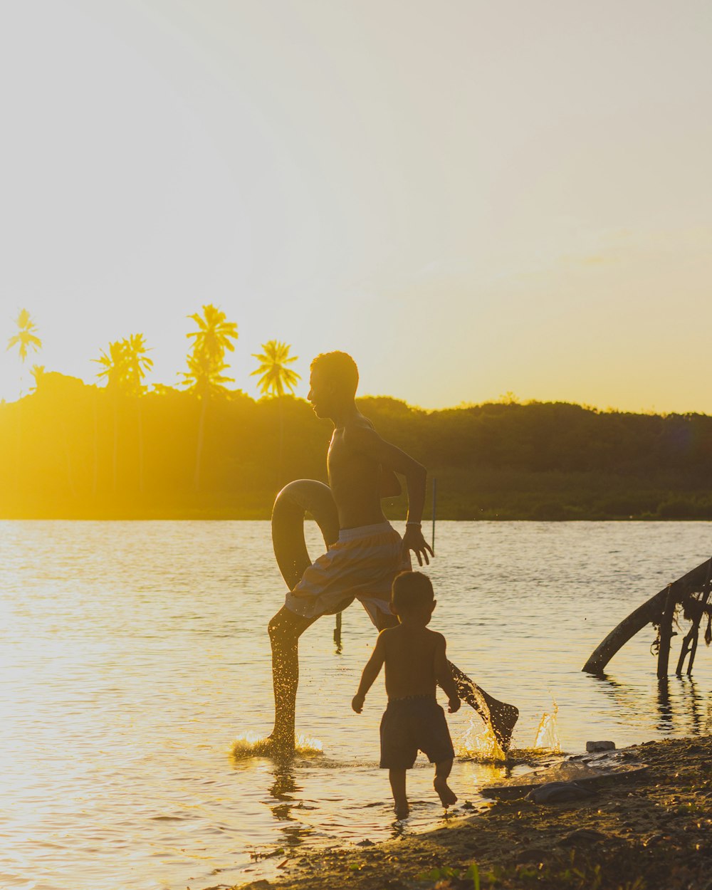 a couple of people that are standing in the water