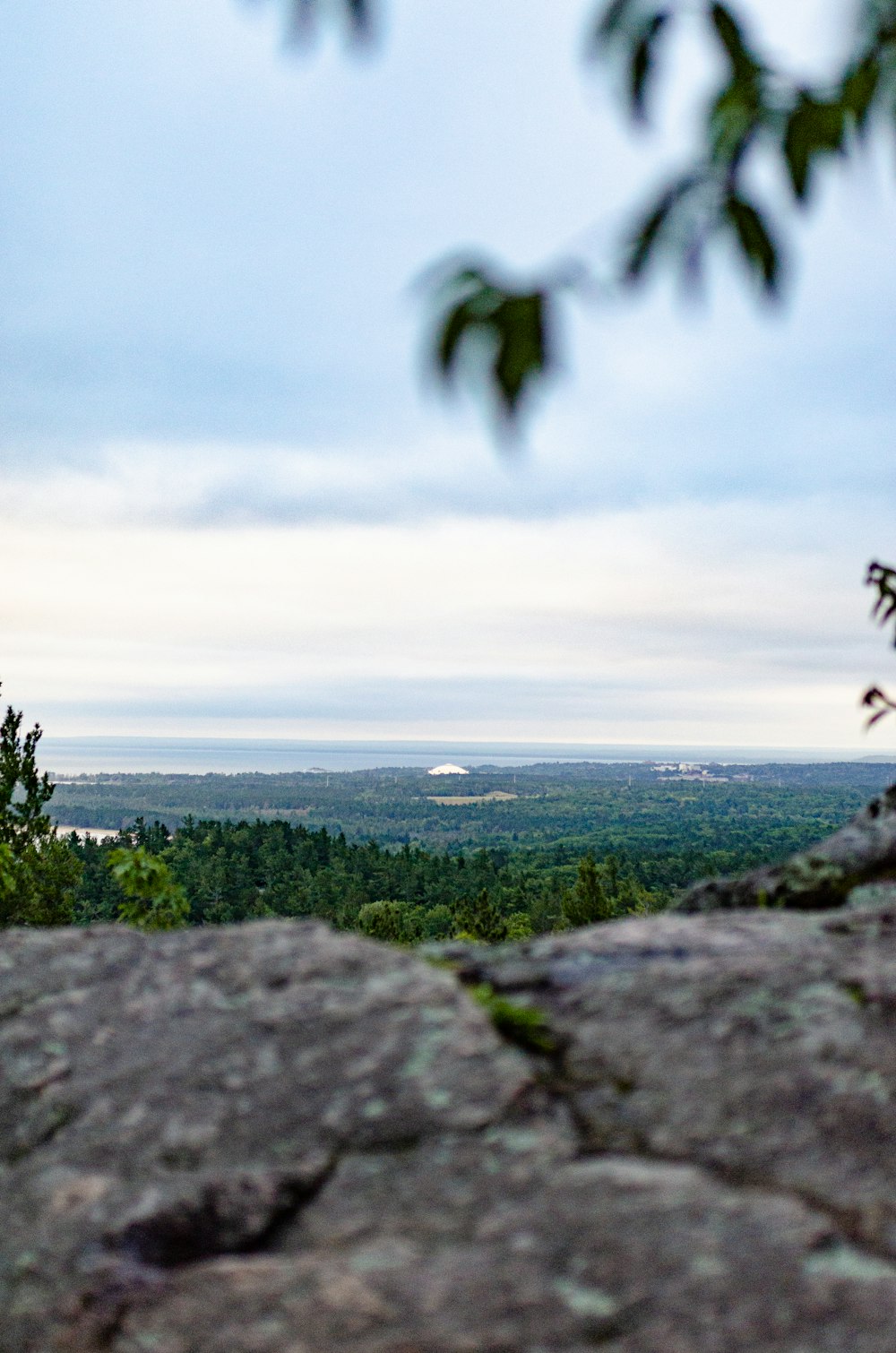 a view of a valley from a rocky outcropping