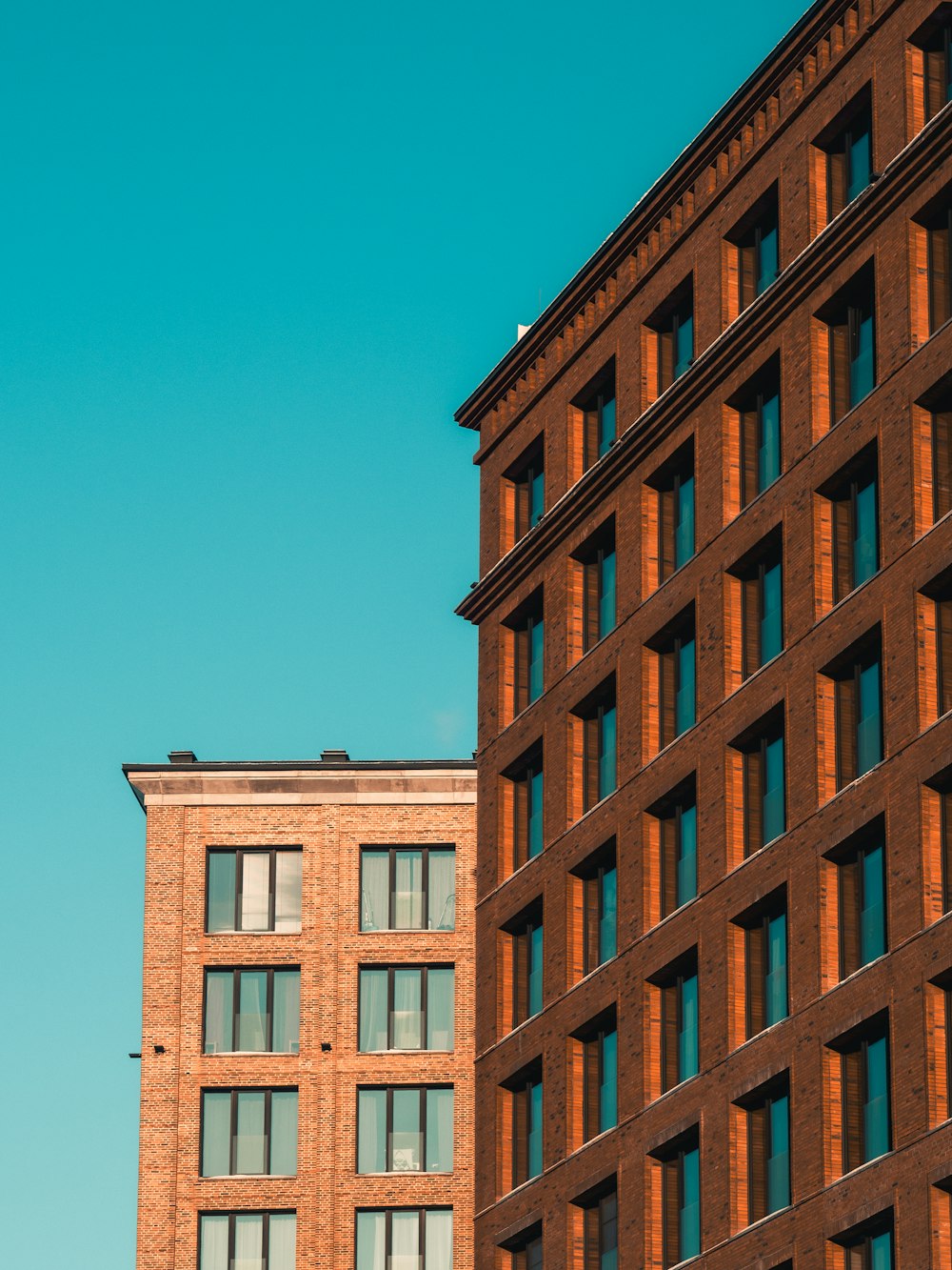 a tall brick building next to a tall brick building