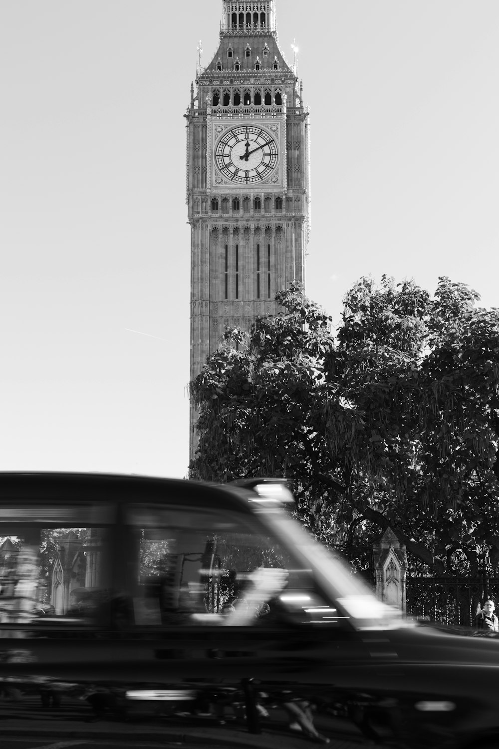 a black and white photo of a clock tower