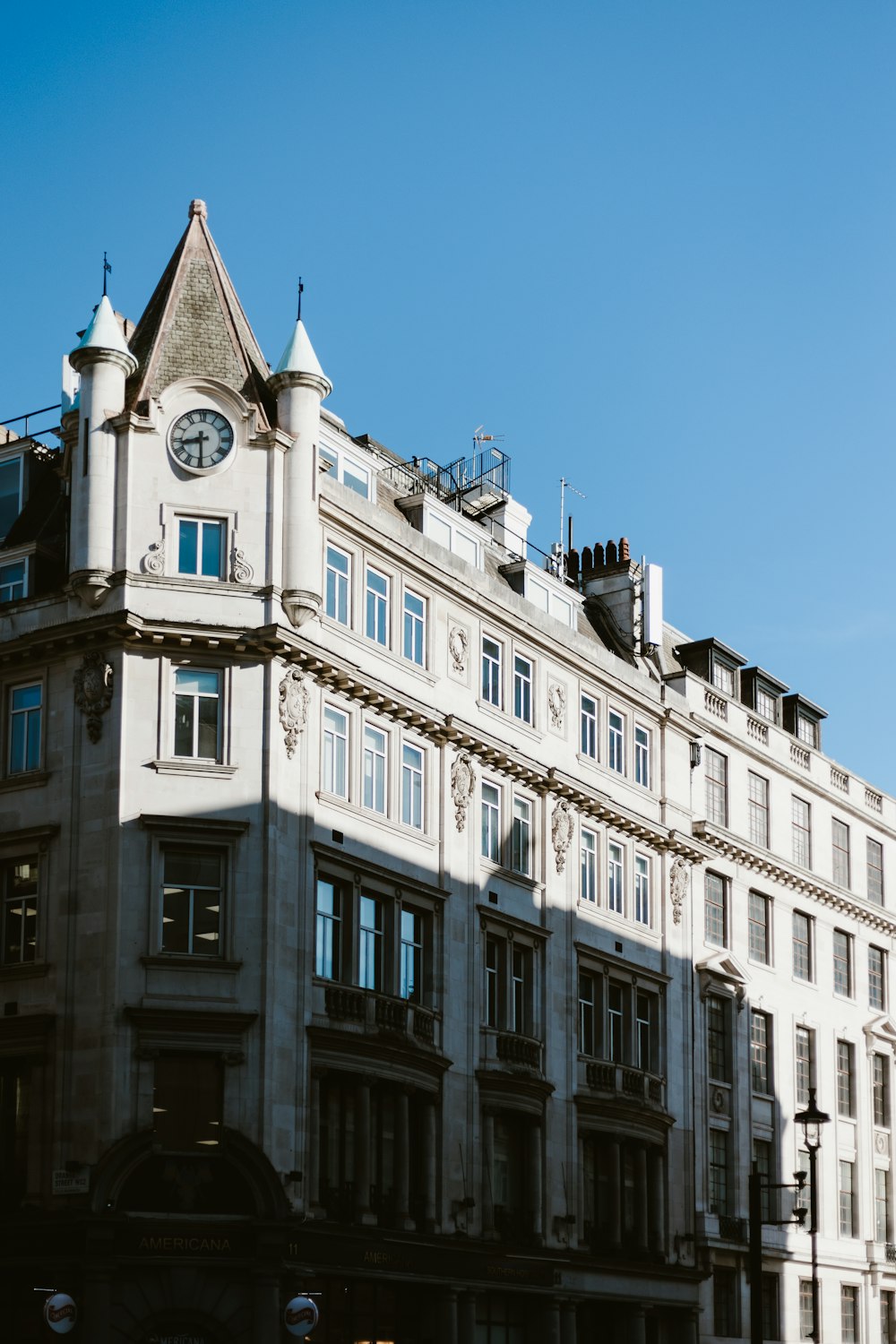 a tall building with a clock on the top of it