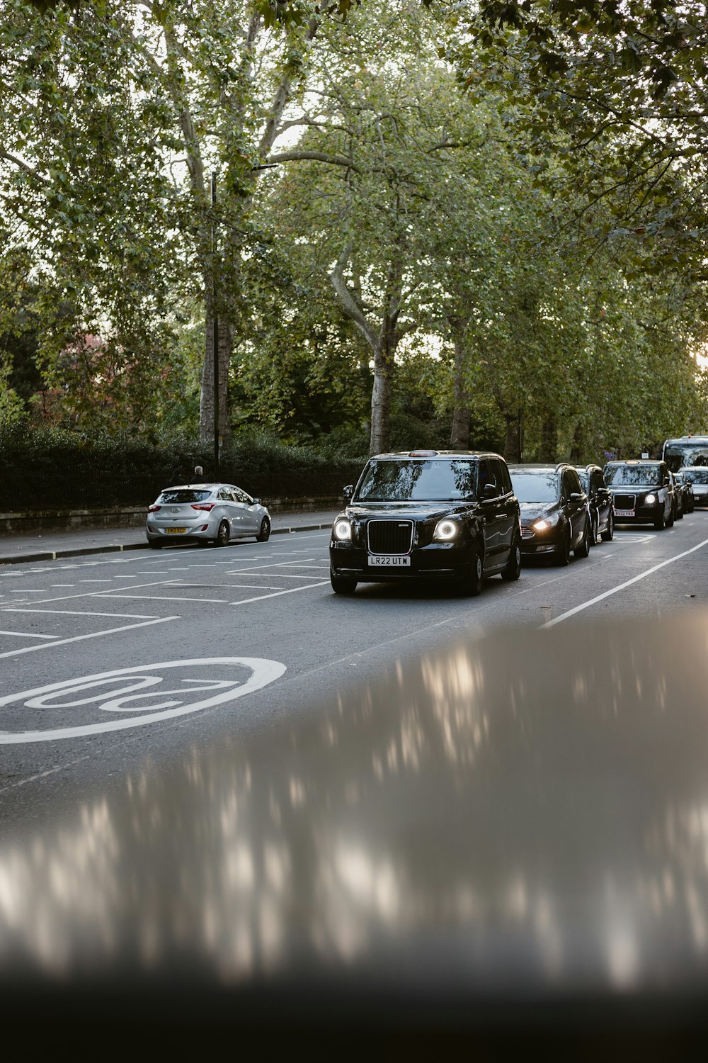 a group of cars parked on the side of a road