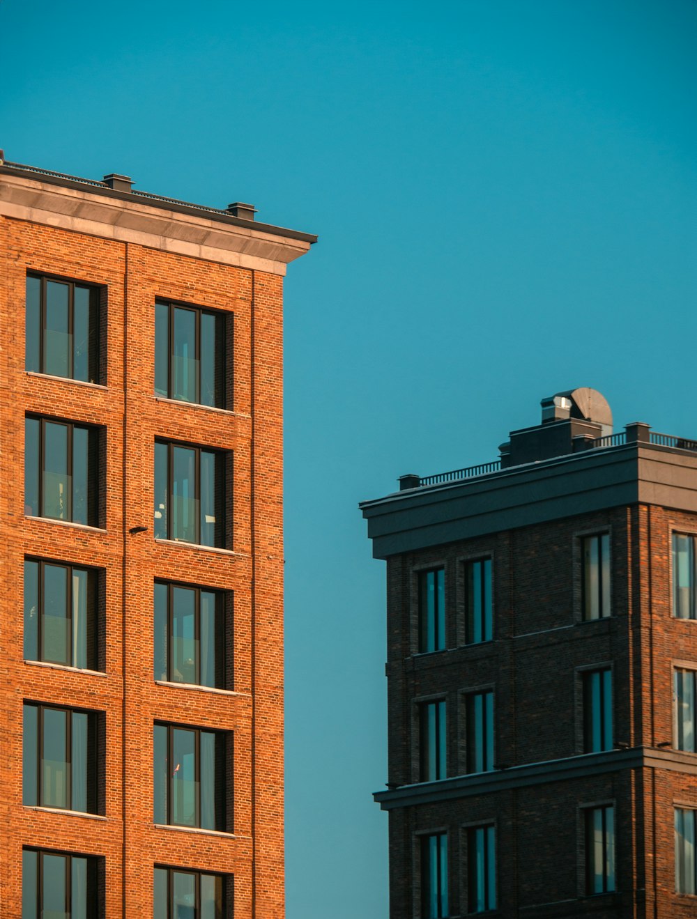 a tall brick building sitting next to a tall brick building