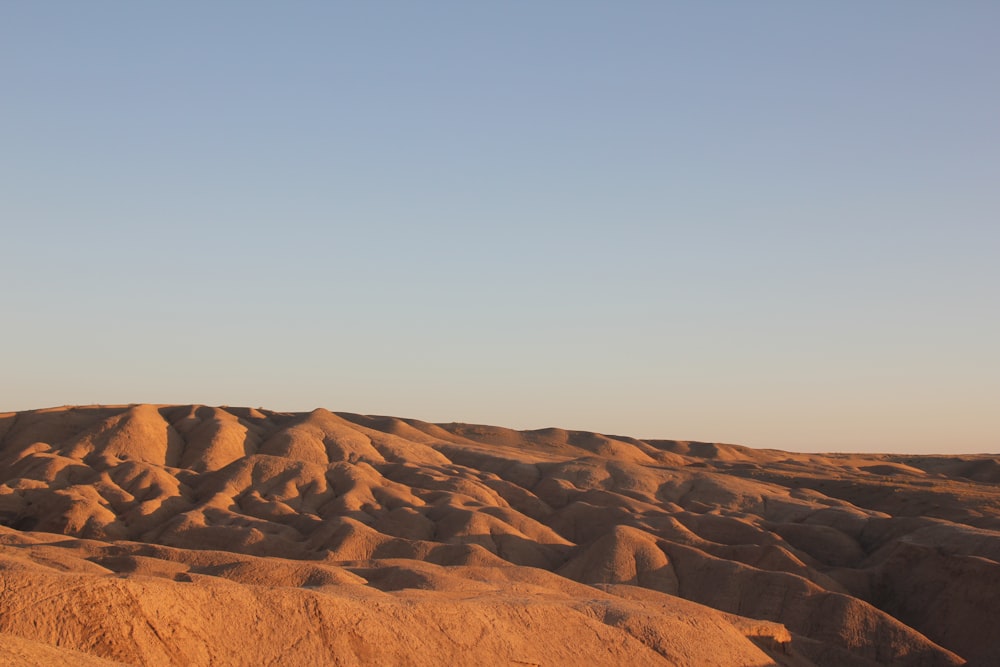 a view of a desert with a sky background