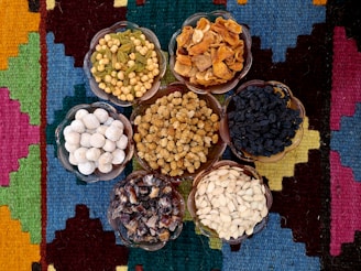 a group of bowls filled with different types of food