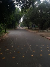 A driving instructor guiding a student in a car on a quiet street.