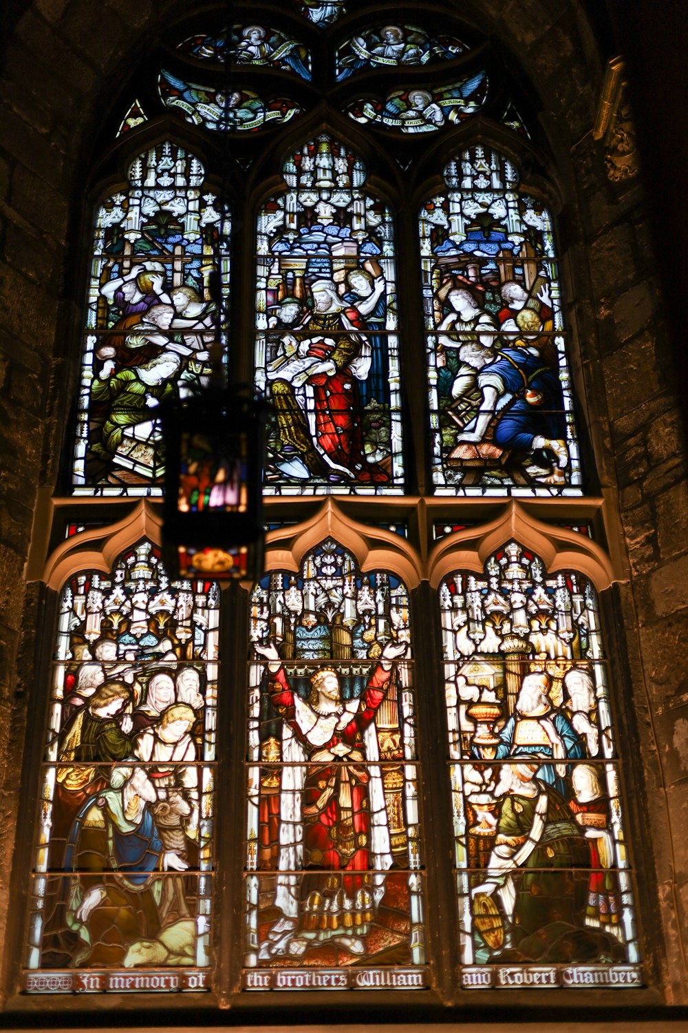 a large stained glass window in a church