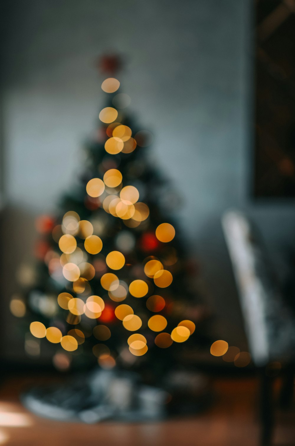 a lit christmas tree in a living room