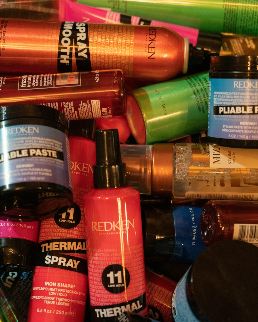 a pile of different types of hair products