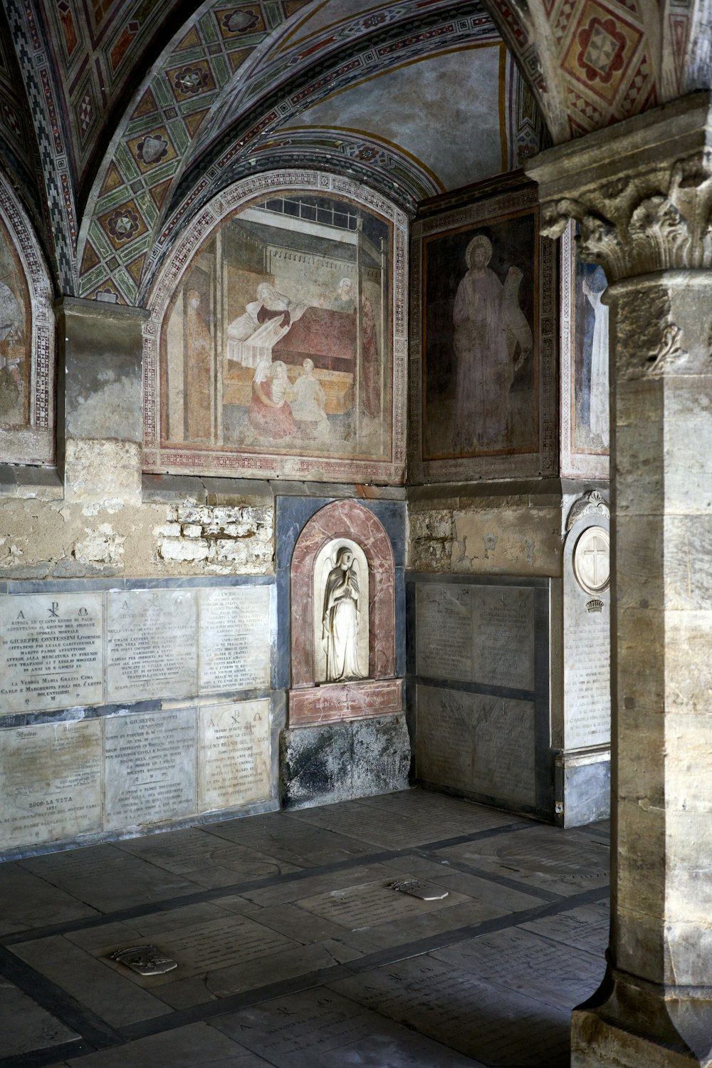 a large room with a painting on the wall