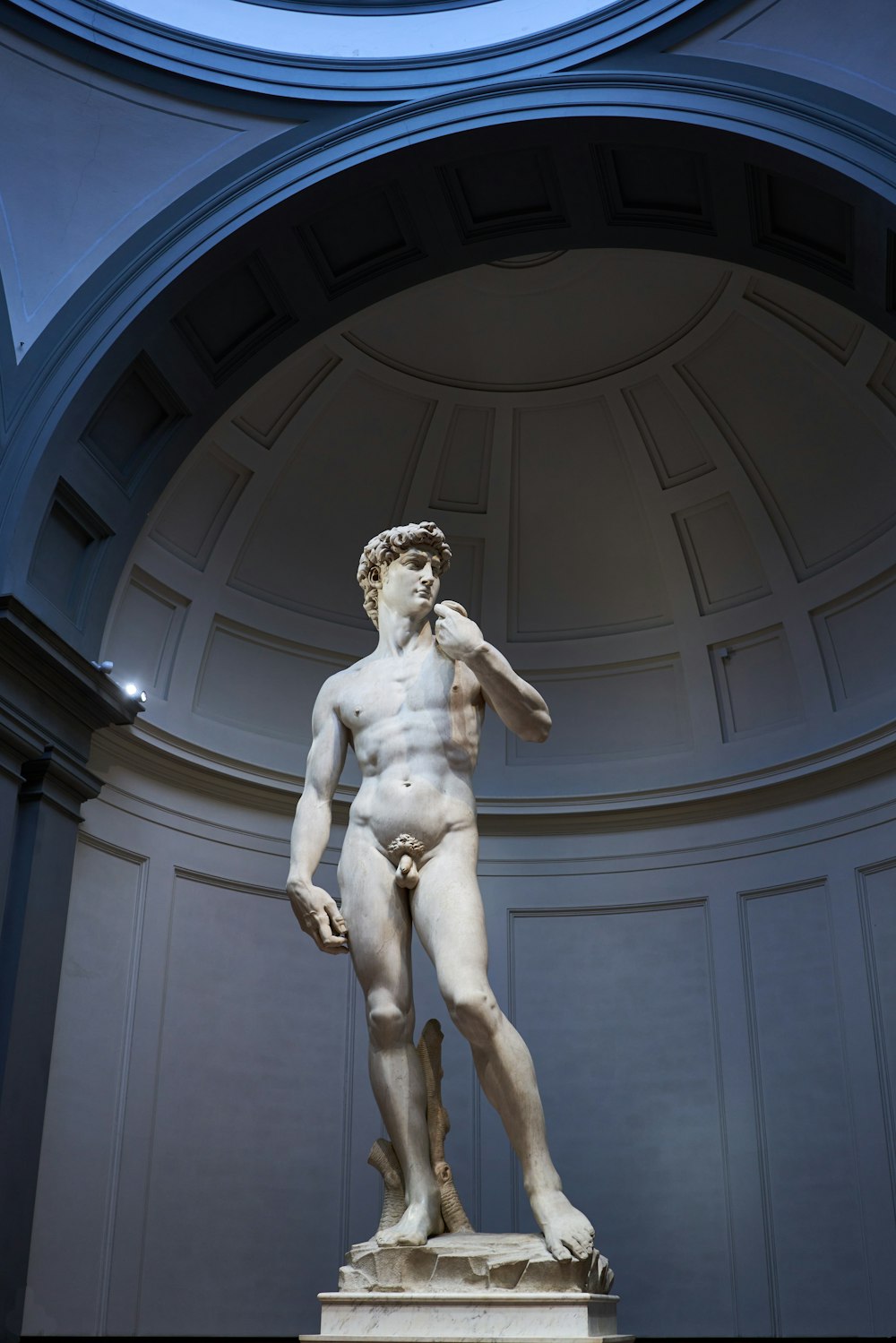 a statue of a man holding a sword