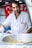 a man in a chef's uniform cuts into a bowl of soup