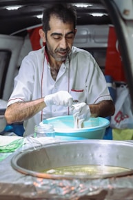 A chef preparing food in a mobile kitchen.